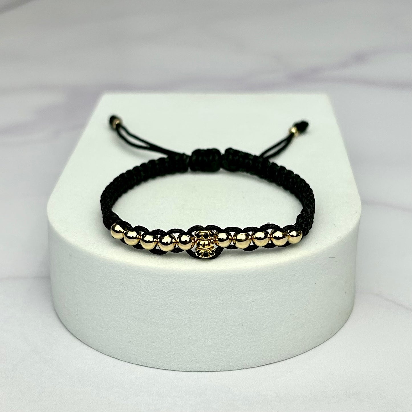 Pulsera Tejida Balin Liso con Hrjs Rondel Italy y circones negro Oro Laminado 18 K NG