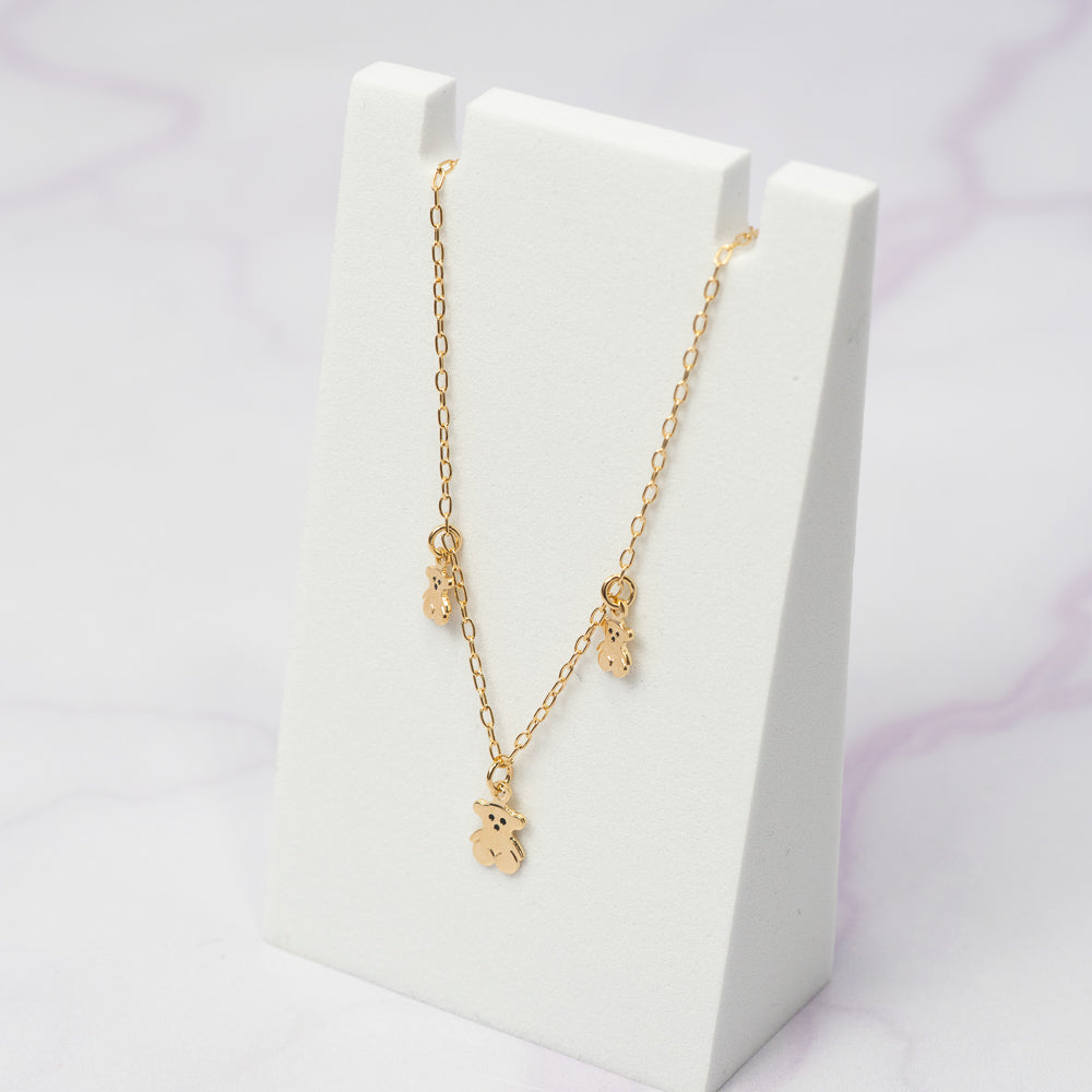 Pulsera Tejido Eslabon con Dijes Tipo Tous, con un ancho de 1.5 mm y un largo de 21 cm